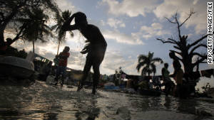 Haitians wash clothes in a stream in Port-au-Prince in January. The widespread user of rivers has been liked to the country&#39;s deadly cholera outbreak.