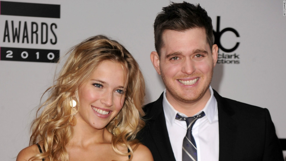 Singer Michael Buble and model Luisana Loreley Lopilato de la Torre arrive on the red carpet for the 2010 American Music Awards at the Nokia Theatre in Los Angeles on November 21, 2010