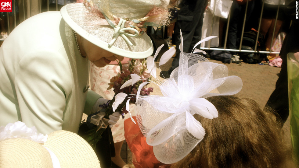 Queen Elizabeth II accepts a bouquet from nine-year-old Tatum Botha, October 24, 2011. Tatum's mom Chaleen says the meeting was a dream come true for her daughter. "The Queen said, 'Thank you.' Tatum replied, 'It's a pleasure.'"
