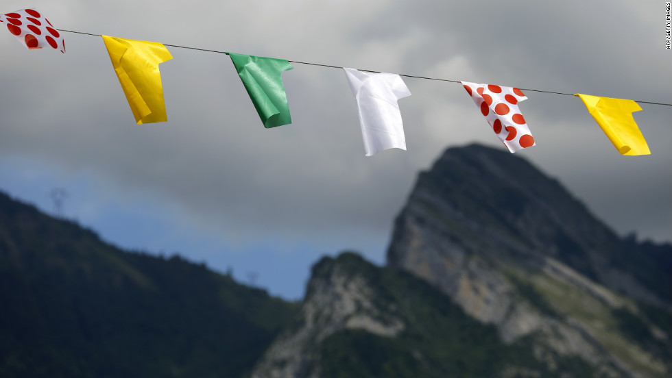 Representations of Tour de France leaders' jerseys hang along the road during Thursday's race.