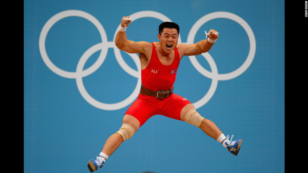 Un Guk Kim of North Korea celebrates his world record while competing in the men's 62-kilogram division weightlifting competition.