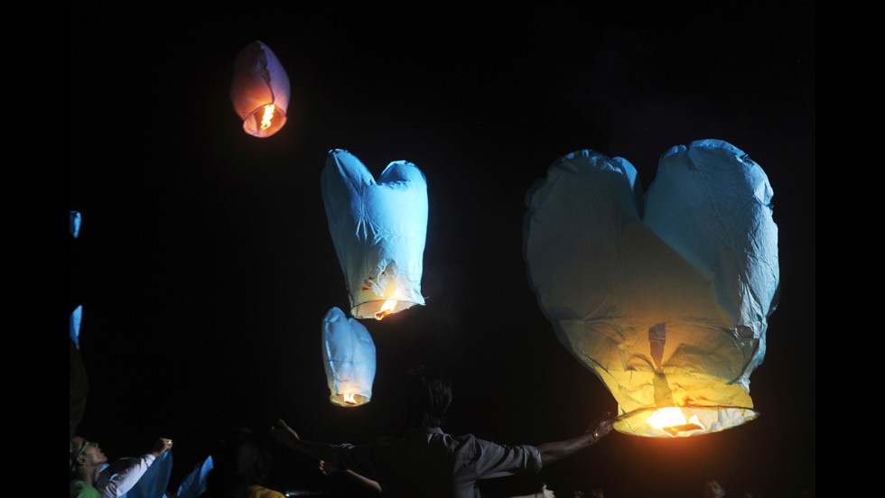 Activists release sky lanterns to promote a peaceful and eco-friendly Diwali and create awareness of child labor in the fire cracker industry during a function in Kolkata, India, on Friday, November 9.