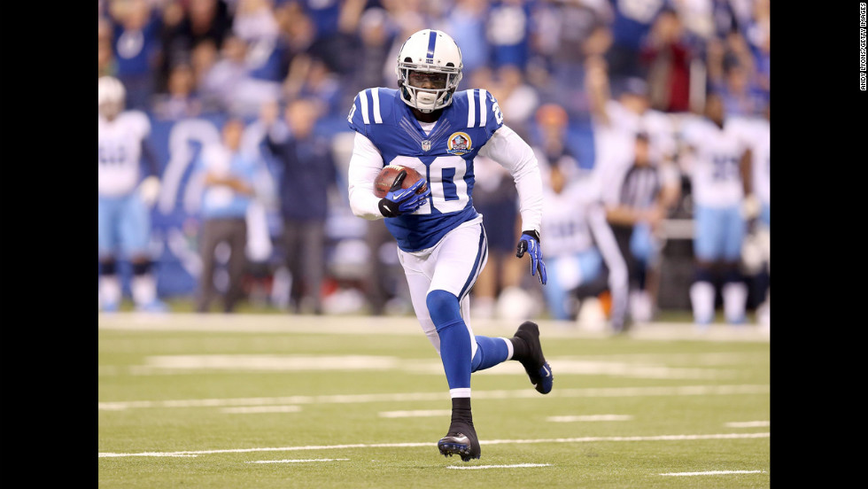 Colts cornerback Darius Butler runs with the ball after intercepting a pass on Sunday.
