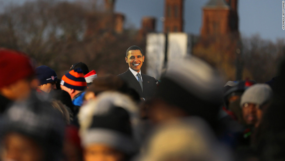 A presidential cutout rises above the crowd gathering Monday near the Capitol.