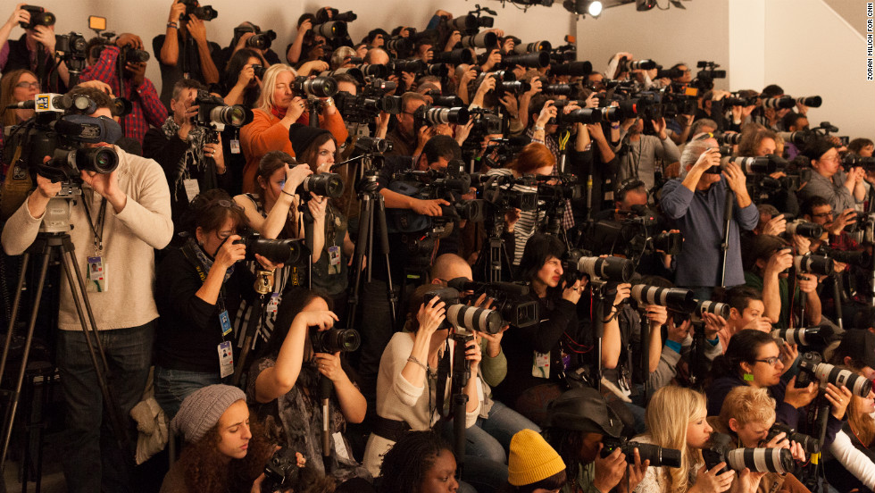 Photographers cram together to shoot the runway on February 10.
