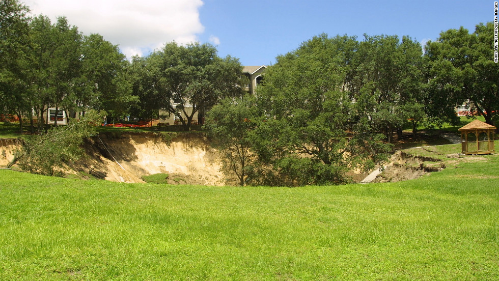 In Orlando, a sinkhole 150 feet wide and 60 feet deep swallowed trees, pipelines and a section of sidewalk near an apartment building in June 2002.