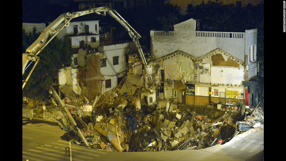 Buildings fell into a sinkhole near a subway construction site in Guangzhou, China, in January 2013. The hole measured about 1,000 square feet across and 30 feet deep and was without casualties, according to a state media report.