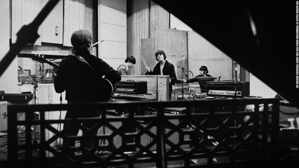 The Beatles are seen recording their seventh album, &quot;Revolver,&quot; at Abbey Road Studios in April 1966 before embarking on a world tour. Revolver was released in August that year and went straight to No. 1 in the U.S. and UK.