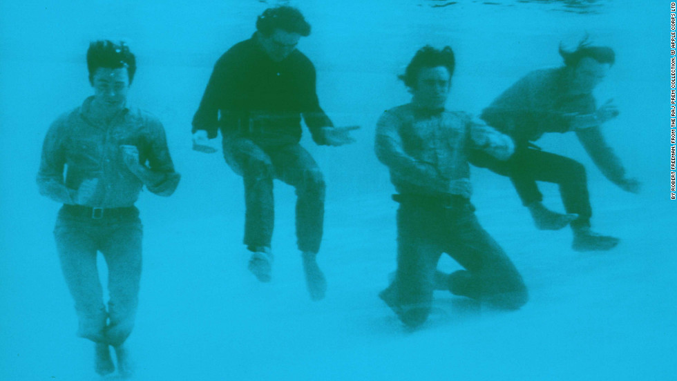 The Beatles pose fully-dressed underwater in the pool of the Nassau Beach Hotel in the Bahamas where they were filming their comedy movie &quot;Help!&quot; Freeman was with them on set.