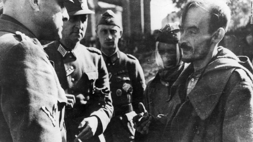Only a handful of fighters survived the uprising.Pictured here is a Polish prisoner of war (right) being interrogated by German officers in Warsaw.