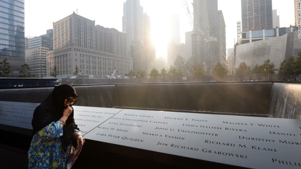 Showkatara Sharif stands next to the engraving of her daughter's name, Shakila Yasmin, at the edge of the north pool at the 9/11 Memorial in New York on September 11.