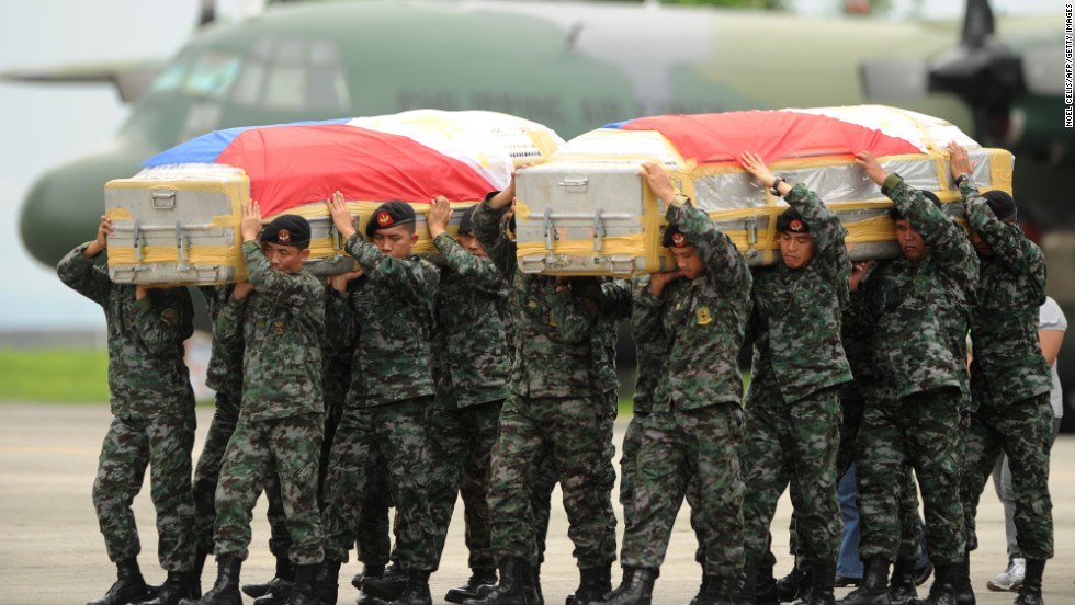 Army Death Pictures Soldiers carry the flag-draped coffin of policemen who died at the Zamboanga rebel attack