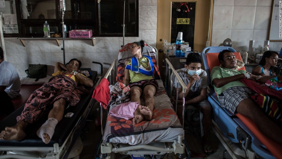 Typhoon victims are treated in the lobby of a Tacloban hospital on November 15.