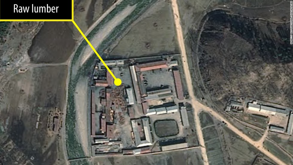 One of four satellite images taken of a probable furniture factory. Lumber piles changed over time, indicating production activity.