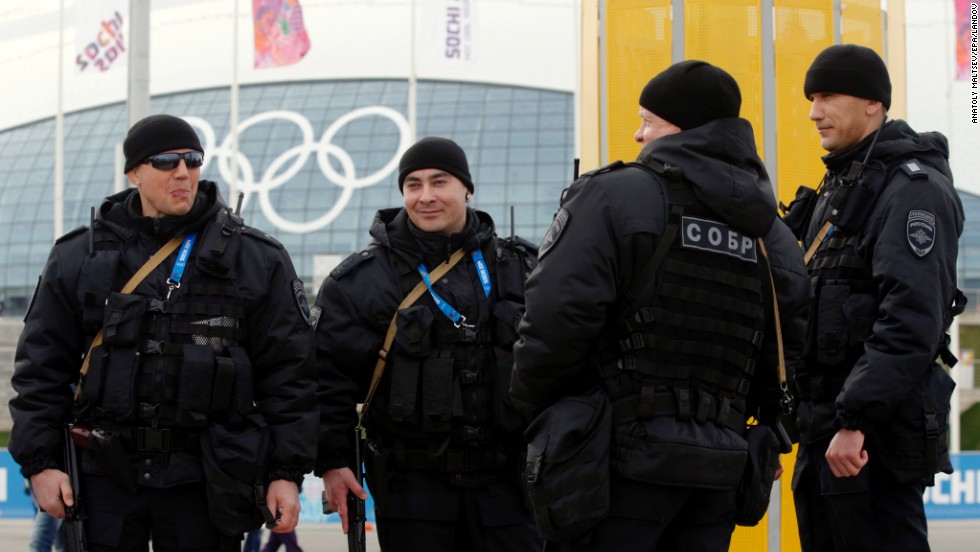 Russian police officers patrol the Olympic Park in Sochi on Sunday, February 9.