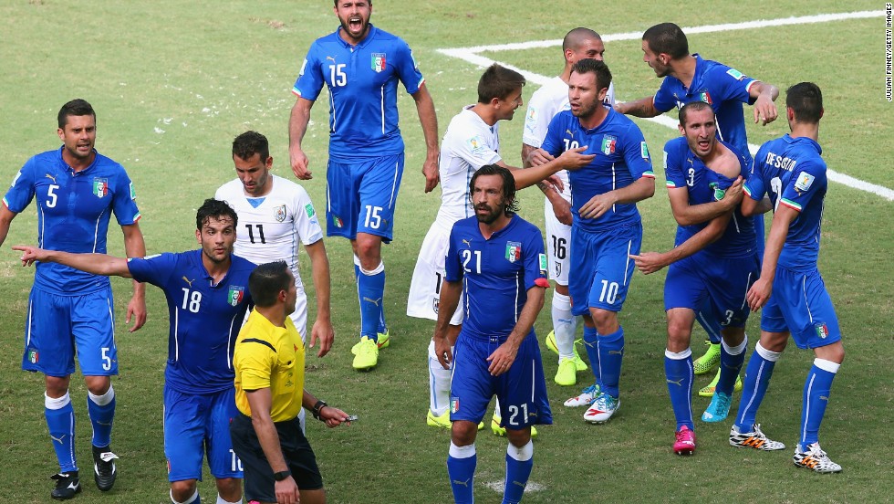 Players from both sides react after the incident. Chiellini later told Rai TV: "It was ridiculous not to send Suarez off. It is clear."