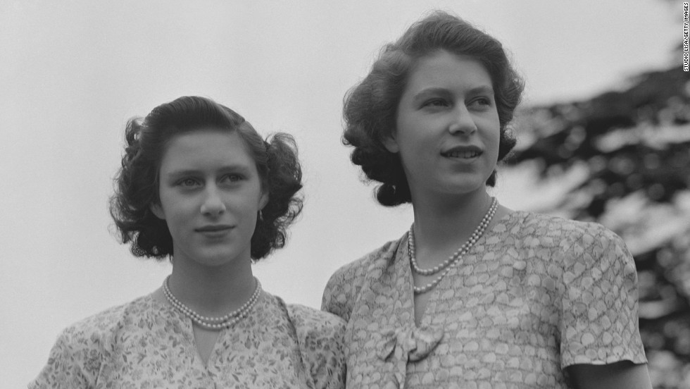 Princess Elizabeth, right, and Princess Margaret wear summer dresses circa 1942. 