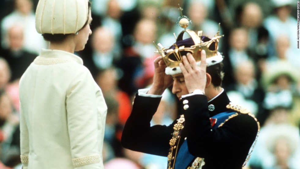 Prince Charles adjusts his coronet during his investiture ceremony as Prince of Wales in 1969. 