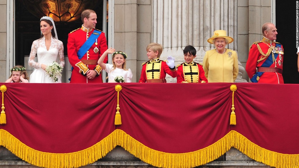 The Queen, second from right, greets a crowd from the balcony of Buckingham Palace on April 29, 2011. Her grandson Prince William, third from left, had just married Catherine Middleton.