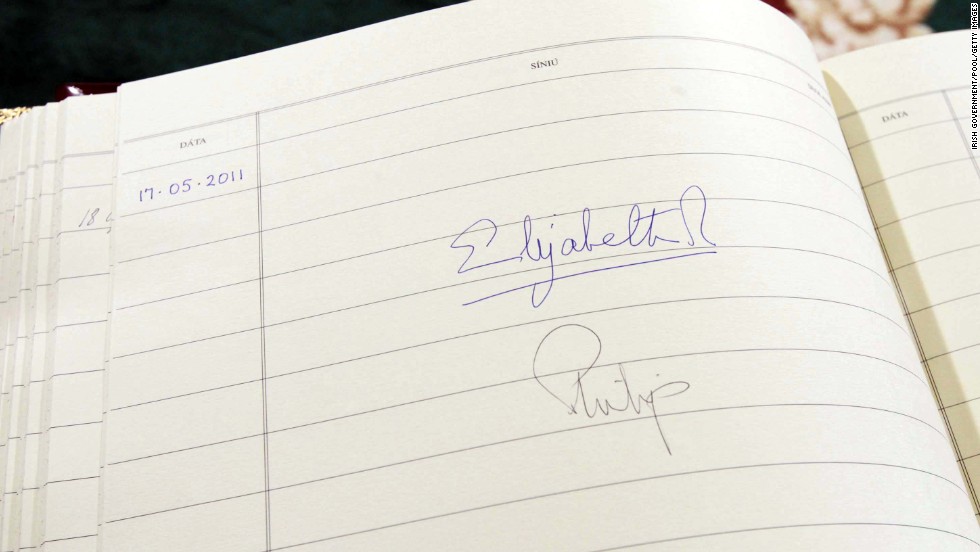 The Queen&#39;s signature is seen in the visitors book at Aras An Uachtarain, the Irish President&#39;s official residence in Dublin, Ireland, in May 2011.