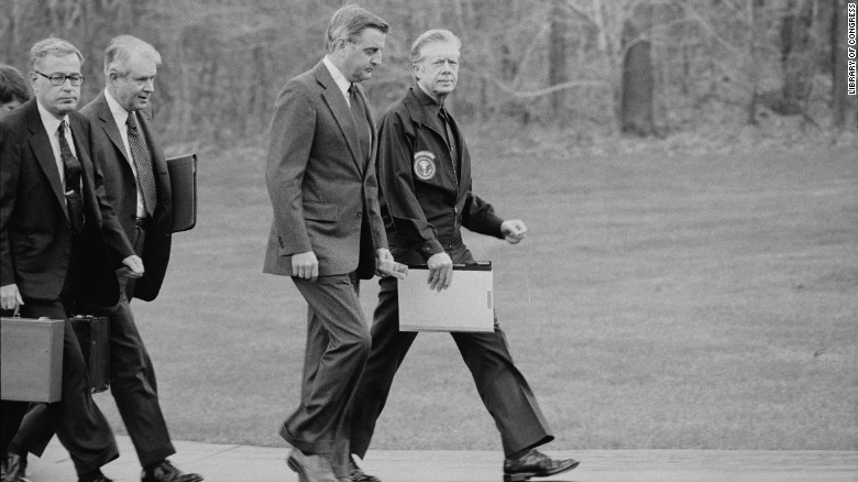 PresidentJimmy Carter, Vice President Walter Mondale, Secretary of State Cyrus Vance and Secretary of Defense Harold Brown disembark from their helicopter to meet about the Iran hostage crisis at Camp David in Maryland on November 23, 1979.