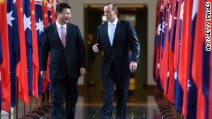 China&#39;s President Xi Jinping (L) and Australia&#39;s Prime Minister Tony Abbott walk together as they leave the House of Representatives at Parliament House in Canberra on November 17, 2014. Xi is visiting Canberra after attending the G20 Summit in Brisbane over the weekend. AFP PHOTO / POOL / Lukas CochLUKAS COCH/AFP/Getty Images