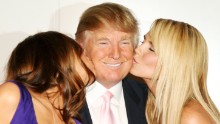Trump and his wife, Melania, left, attend the launch of Trump International Hotel and Tower Dubai with model Heidi Klum on June 23, 2008, at the Park Avenue Plaza in New York City.