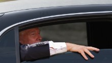 Trump looks out the window of his limousine after visiting Newick's Lobster House on April 27, 2011, in Dover, New Hampshire.