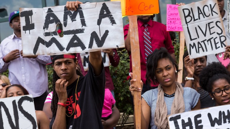 Protesters in North Charleston decry Walter Scott&#39;s death shortly after the shooting. 