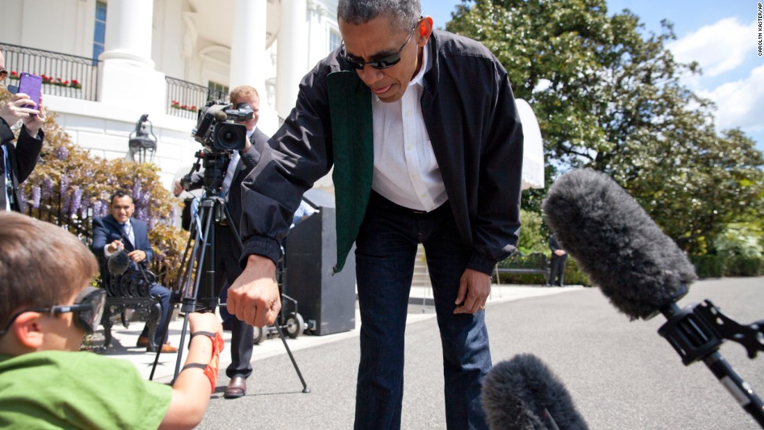 Obama gives superhero fist bump photo