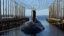 The Seawolf-class attack submarine USS Jimmy Carter is moored in a Washington state facility that reduces a ship's electromagnetic signature in 2006. The Jimmy Carter is 100 feet longer than the first two subs in its class. The extra space is for a "multimission platform," the Navy says. "This hull section provides for additional payloads to accommodate advanced technology used to carry out classified research and development and for enhanced warfighting capabilities."