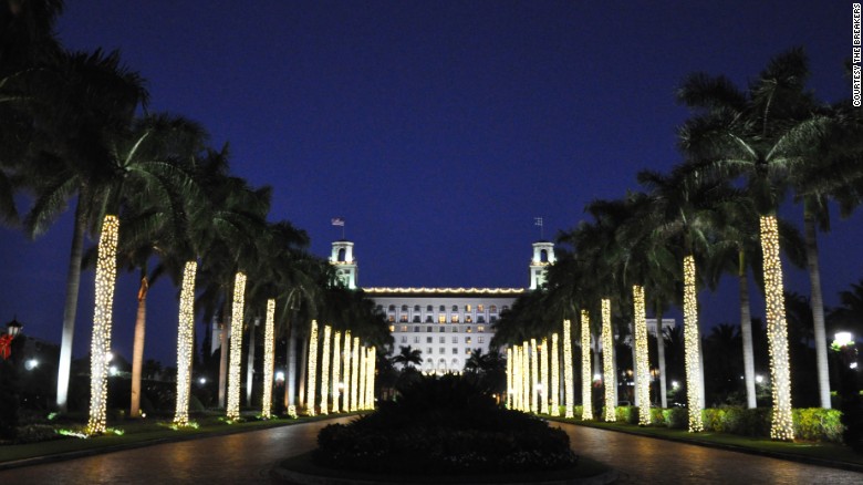 The Breakers in Palm Beach, Florida, welcomes guests along an alley of twinkling palms.