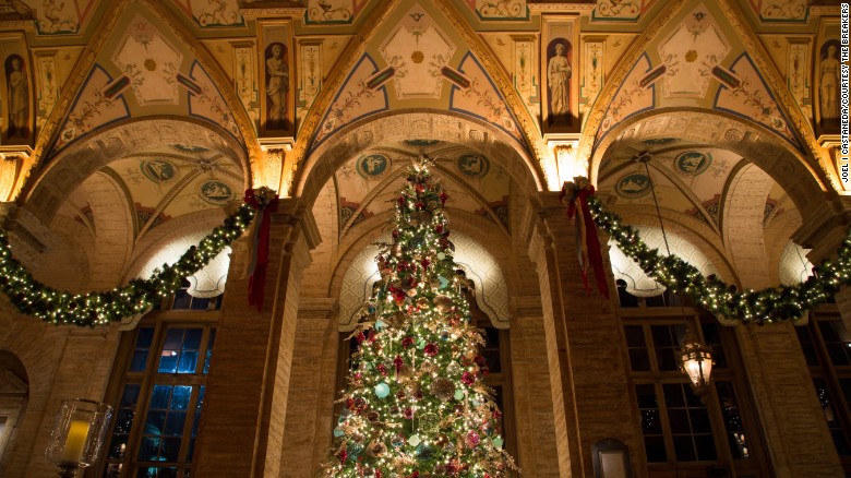 Inside, holiday decorations heighten the drama in the Renaissance-inspired lobby.