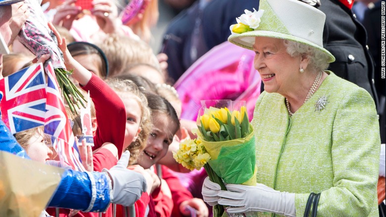 Queen Elizabeth II acknowledges the crowd as she celebrates her 90th birthday in Windsor, England, on April 21, 2016.