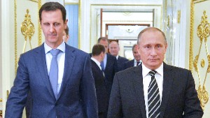 Russian President Vladimir Putin (R) greets his Syrian counterpart Bashar al-Assad upon his arrival for a meeting at the Kremlin in Moscow on October 20, 2015. Assad, on his first foreign visit since Syria&#39;s war broke out, told his main backer and counterpart Putin in Moscow that Russia&#39;s campaign in Syria has helped contain &quot;terrorism&quot;. / AFP / RIA NOVOSTI / ALEXEY DRUZHININ (Photo credit should read ALEXEY DRUZHININ/AFP/Getty Images)