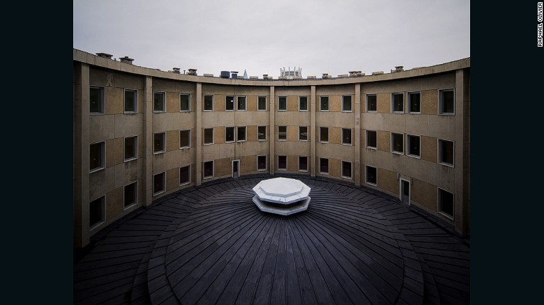 &quot;Atrium view of the Changgwang-won health complex. The building&#39;s circular form made of raw concrete reflect a socialist modernist style. The tips of the Ice Rink and Ryugyong Hotel can be seen in the background.&quot;