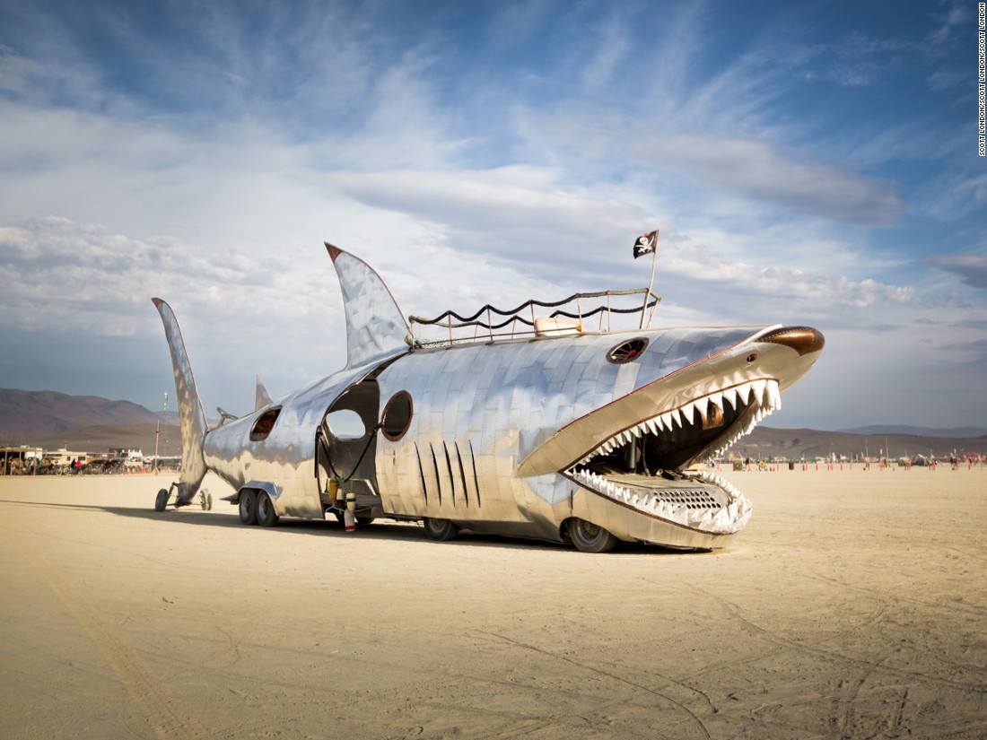 &quot;This art car has a long history at Burning Man, first appearing in 2002. Originally created by Sid Kurz, it belongs to the Seattle-based Lodi Camp. The Shark Car has undergone many redesigns over the years. It returned with a shiny aluminum finish in 2016 but spent much of the week out of commission.&quot;