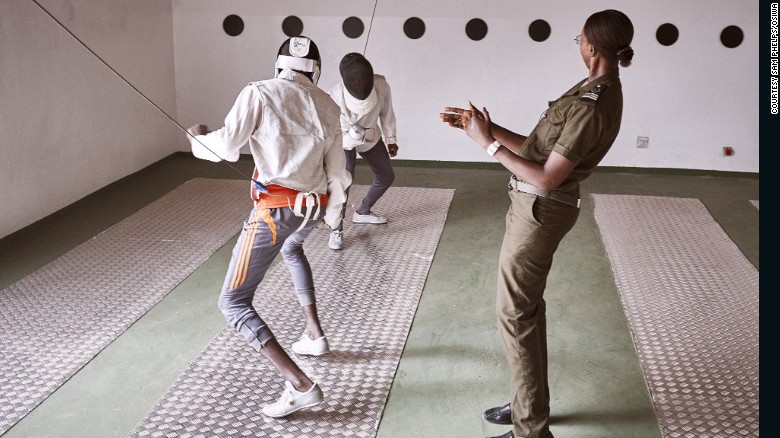 Prison guard Fatoumata Sy referees a fencing match between minors.