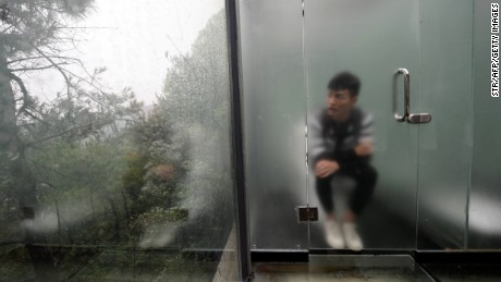 Glass washrooms in China offer stunning views of the forest -- and other users