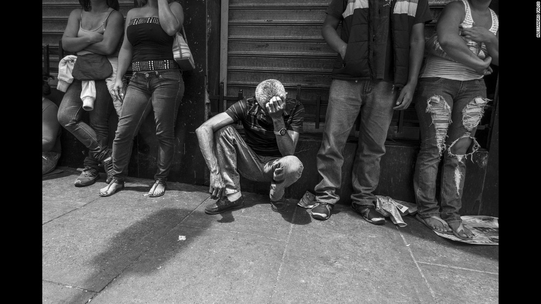 A man waits in line to buy some bread in the Chacao district of Caracas, Venezuela. The country is facing a severe economic crisis, and a large part of the population has no access to essential food products at a reasonable price.