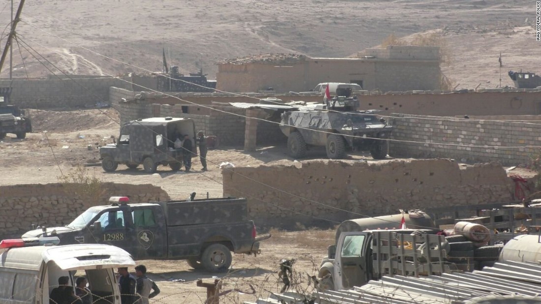 Iraq&#39;s federal police reach hills overlooking Hammam al-Alil, south of Mosul, on Friday.