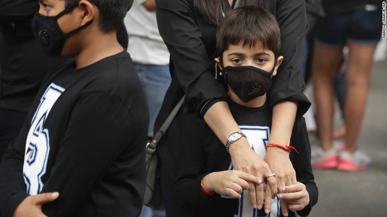 Children wear pollution masks at a protest against air pollution in New Delhi on Sunday.