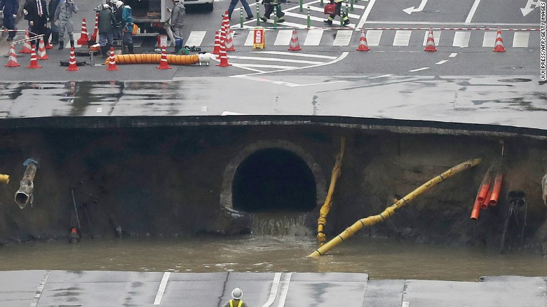 Gigantic Sinkhole Swallows Road In Japanese City