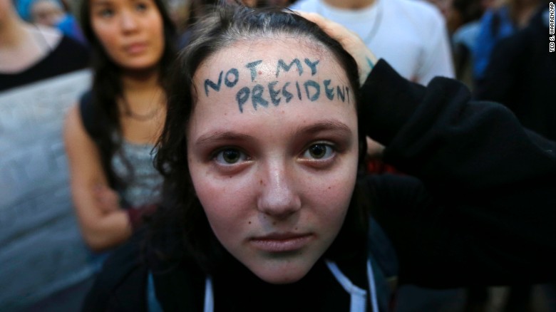 Clair Sheehan takes part in a protest on Wednesday against President-elect Donald Trump, in downtown Seattle.