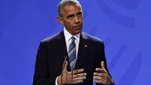 US President Barack Obama addresses a press conference with the German Chancellor after their meeting at the chancellery  in Berlin on November 17, 2016.US President Barack Obama pays a farewell visit to German Chancellor Angela Merkel, seen by some as the new standard bearer of liberal democracy since the election of Donald Trump. 