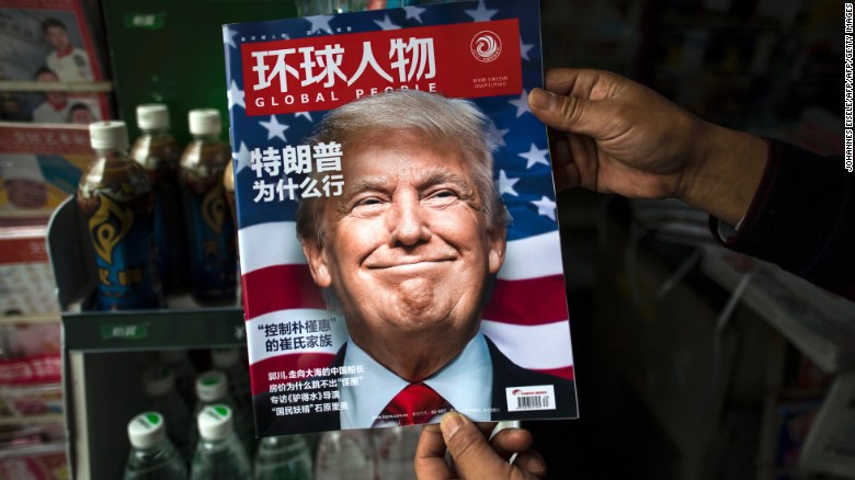 TOPSHOT - A copy of the local Chinese magazine Global People with a cover story that translates to &quot;Why did Trump win&quot; is seen with a front cover portrait of US president-elect Donald Trump at a news stand in Shanghai on November 14, 2016. Chinese President Xi Jinping and US president-elect Donald Trump agreed November 14 to meet &quot;at an early date&quot; to discuss the relationship between their two powers, Chinese state broadcaster CCTV said. / AFP / JOHANNES EISELE (Photo credit should read JOHANNES EISELE/AFP/Getty Images)