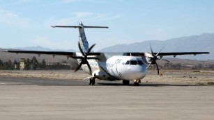 An ATR-42, pictured in 2011, is a twin-engine propeller plane.