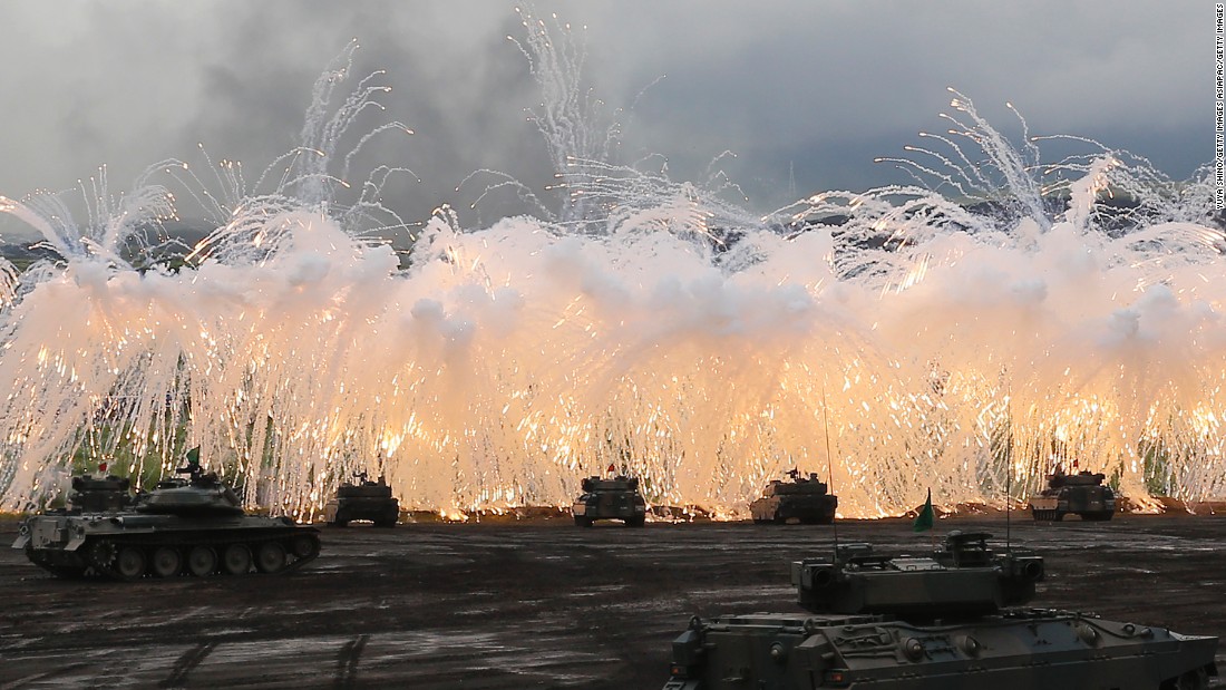 Japan Self-Defense Force tanks and other armored vehicles take part in an exercise at the military's East Fuji Maneuver Area on August 25, 2016, in Gotemba, Japan. Japan has one tank division and three armored infantry divisions.