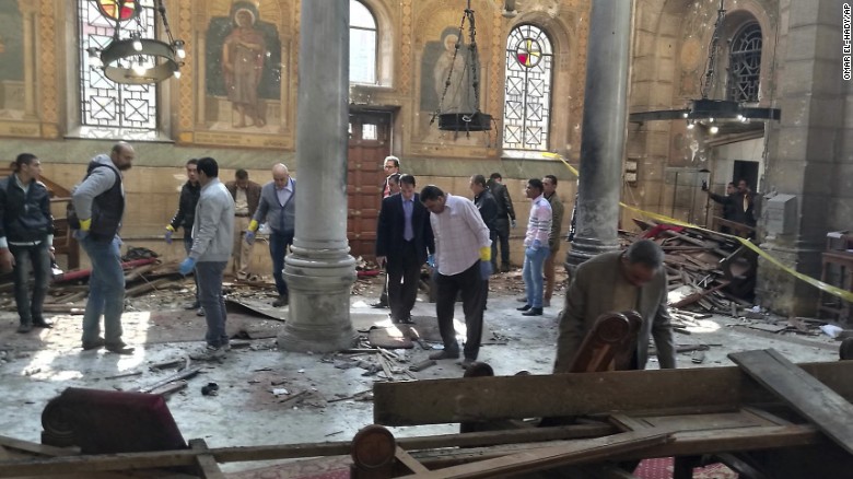 Egyptian security forces examine the scene inside St. Mark Cathedral in central Cairo, following a bombing, Sunday, Dec. 11, 2016. 