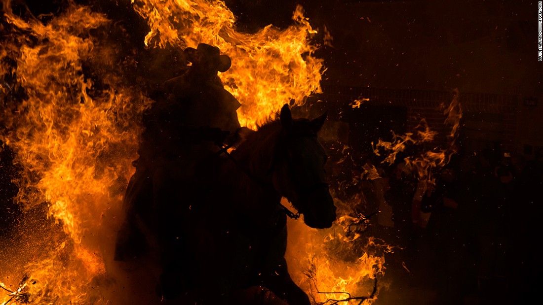 Lluís Salvadó of Spain scooped top prize in the Journeys & Adventures single image category for this shot from the fiery festival of Saint Anton in San Bartolomé de Pinares, Spain.